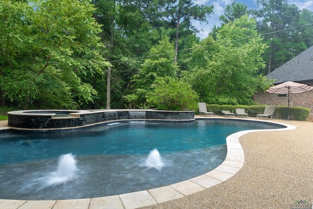 view of pool with pool water feature and an in ground hot tub