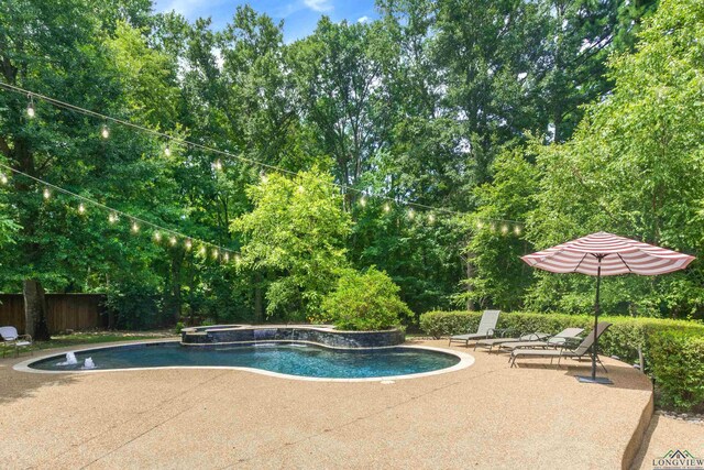 view of pool featuring an in ground hot tub and a patio