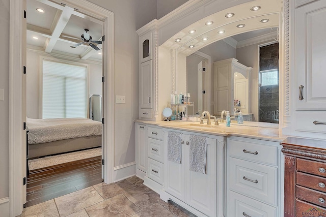 bathroom featuring vanity, coffered ceiling, ceiling fan, ornamental molding, and beamed ceiling