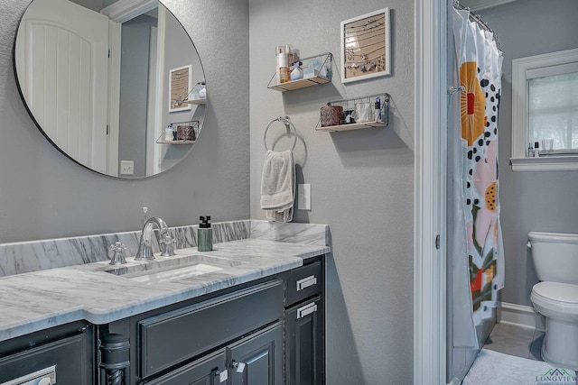 bathroom with vanity and toilet