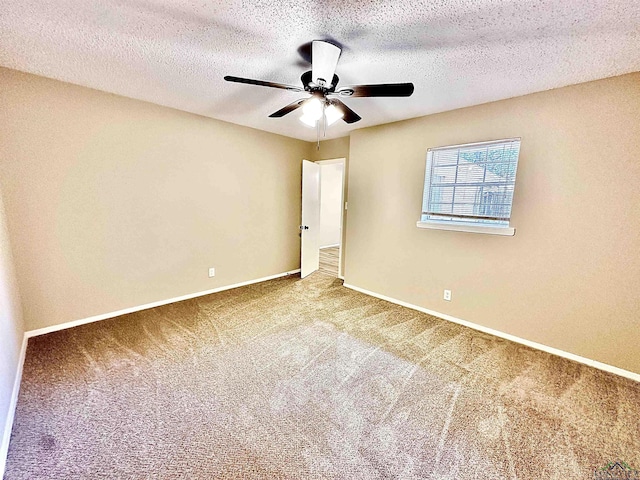 unfurnished bedroom with carpet floors, a textured ceiling, and ceiling fan