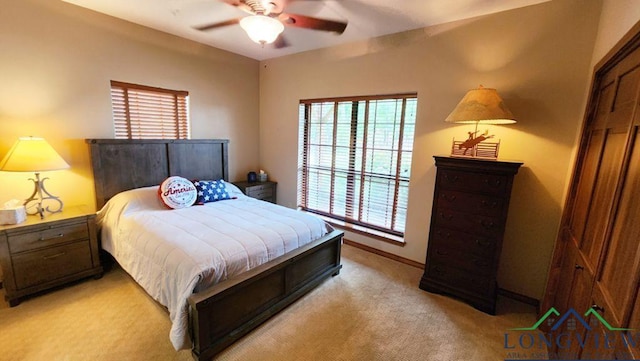 4350 Fm 1650, Gilmer, TX 75645 - bedroom with multiple windows, light colored carpet, and ceiling fan