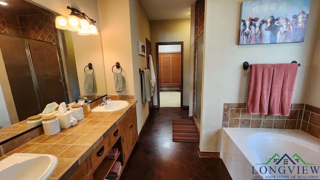 4350 Fm 1650, Gilmer, TX 75645 - full bath with double vanity, a garden tub, a shower stall, and tile patterned flooring