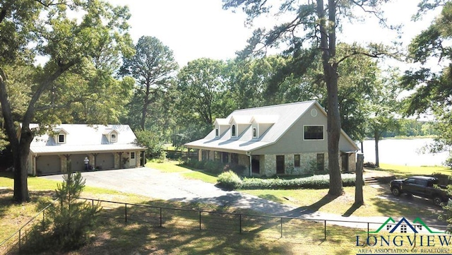 4350 Fm 1650, Gilmer, TX 75645 - view of front facade with asphalt driveway, an attached garage, and view of wooded area