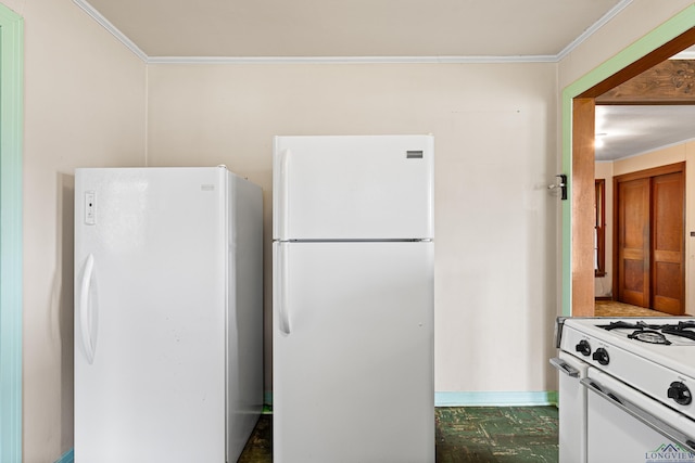 kitchen with white appliances and ornamental molding