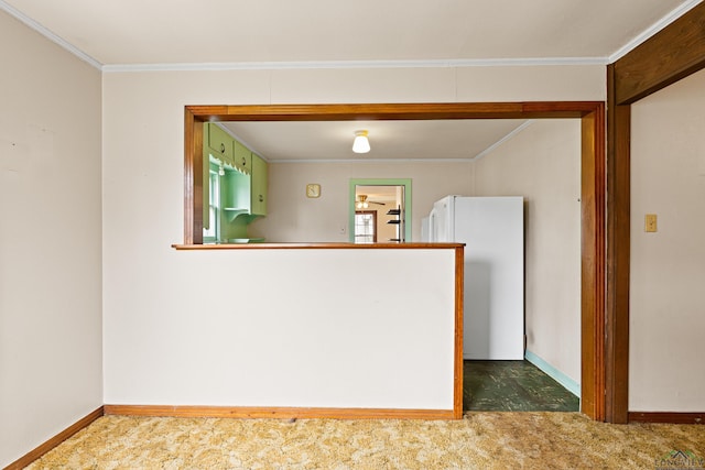 carpeted empty room with ceiling fan and crown molding