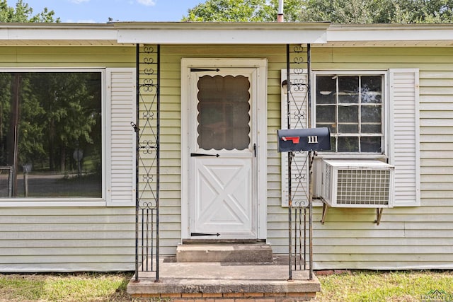 entrance to property featuring cooling unit