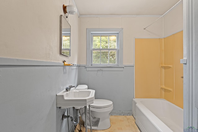 full bathroom featuring toilet, sink, and bathtub / shower combination