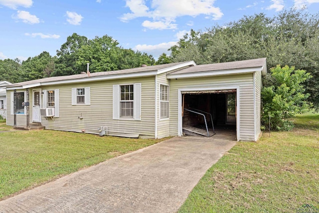 view of front of home with cooling unit, a front lawn, and a garage