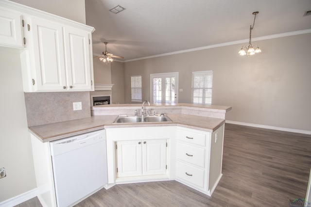 kitchen with white dishwasher, white cabinetry, kitchen peninsula, and sink