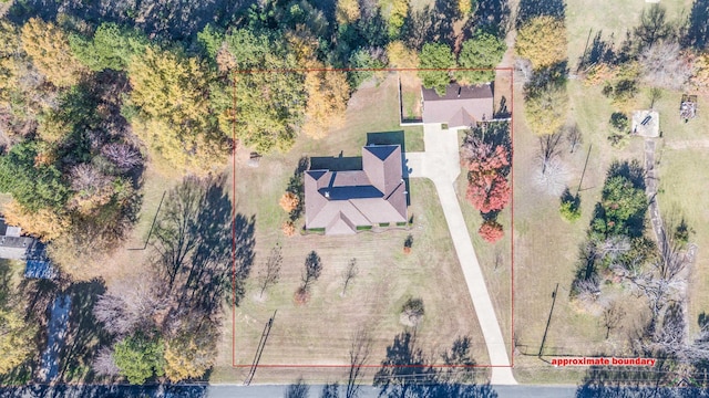 birds eye view of property with a rural view