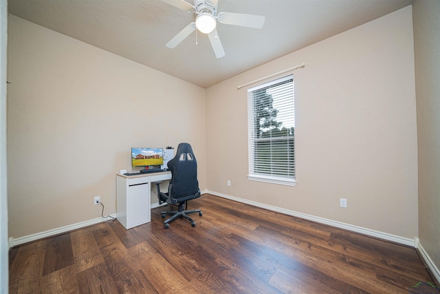 home office with dark hardwood / wood-style flooring and ceiling fan