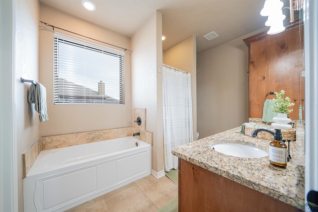 bathroom with tile patterned flooring, vanity, toilet, and a washtub