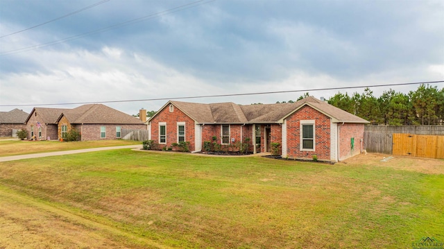 single story home with a front yard