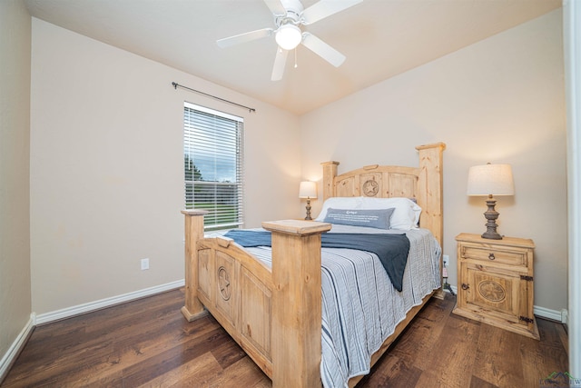 bedroom featuring dark hardwood / wood-style flooring and ceiling fan