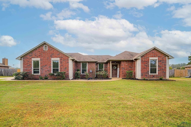 single story home with a front lawn