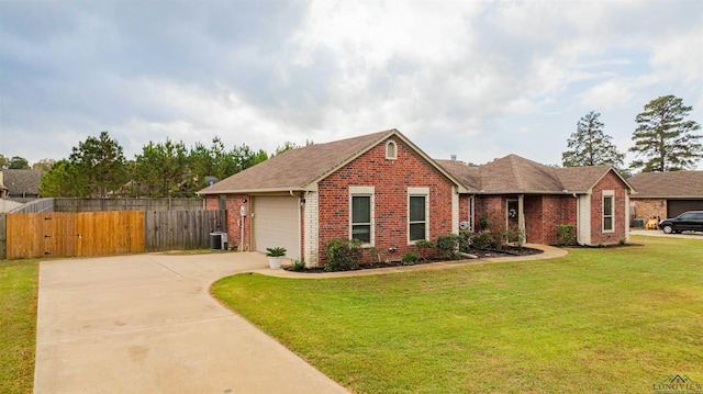 view of front of property featuring a front lawn and a garage