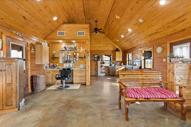 misc room featuring ceiling fan, wood walls, high vaulted ceiling, concrete floors, and wood ceiling