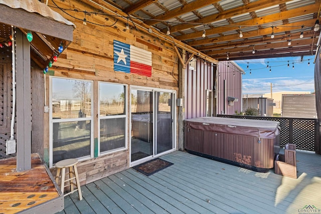 deck with a hot tub