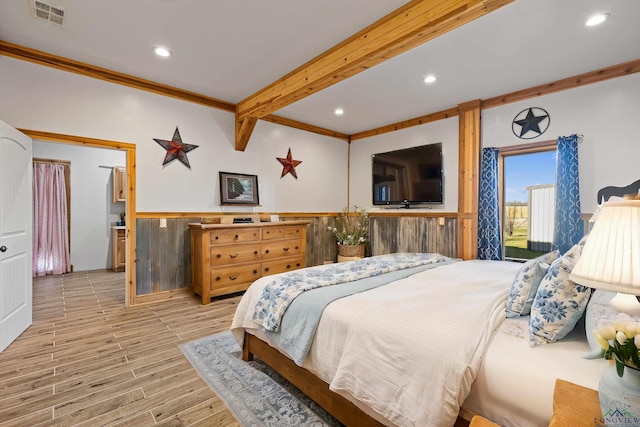 bedroom with crown molding and beamed ceiling