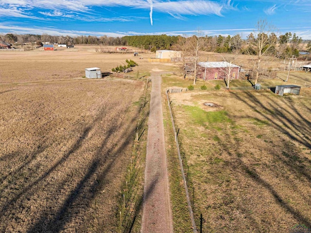 birds eye view of property with a rural view