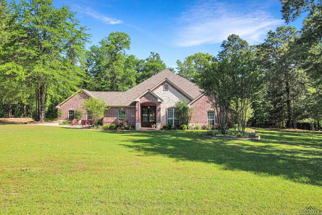 24130 Stallion Park Pl, Lindale, TX 75771 - ranch-style home featuring brick siding and a front lawn