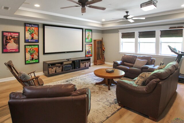 24130 Stallion Park Pl, Lindale, TX 75771 - home theater featuring ceiling fan, a tray ceiling, visible vents, wood finished floors, and baseboards