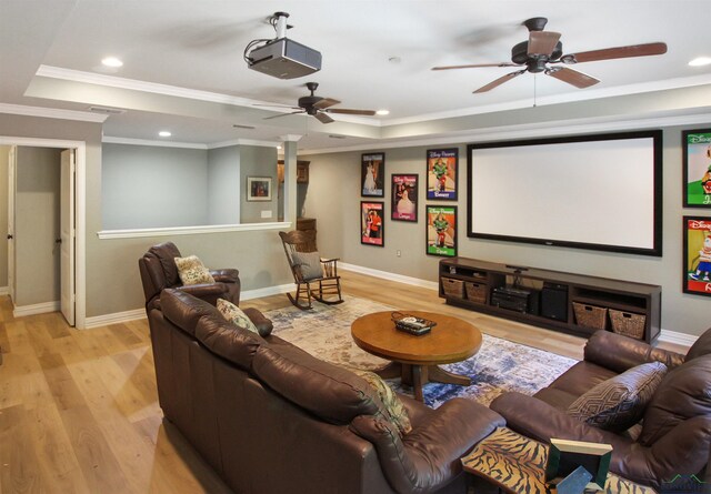 24130 Stallion Park Pl, Lindale, TX 75771 - home theater with a tray ceiling, light wood-type flooring, ceiling fan, and ornamental molding