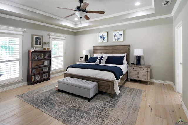 24130 Stallion Park Pl, Lindale, TX 75771 - bedroom featuring visible vents, a raised ceiling, hardwood / wood-style floors, and multiple windows