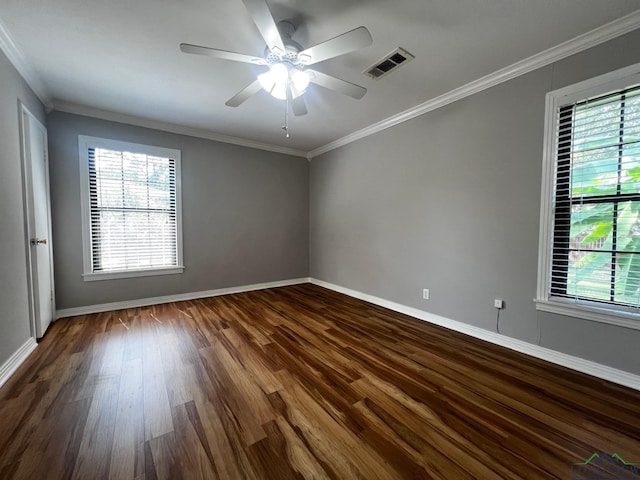 spare room featuring crown molding, hardwood / wood-style floors, and ceiling fan