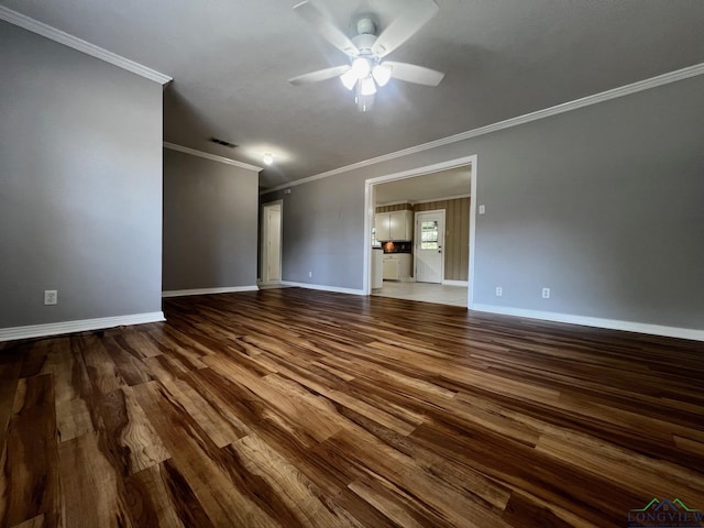 empty room featuring ceiling fan, hardwood / wood-style floors, and ornamental molding