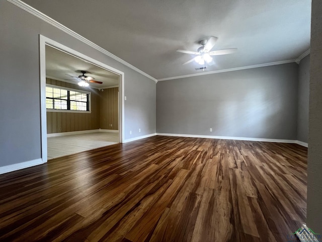 unfurnished room featuring wood-type flooring, ceiling fan, and ornamental molding