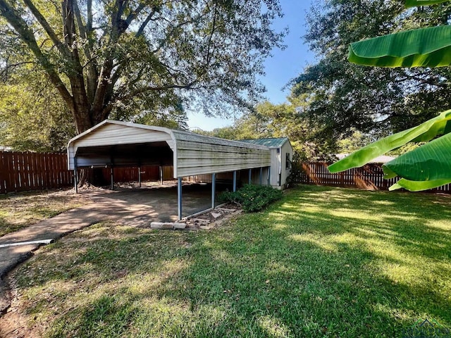 view of yard with a carport