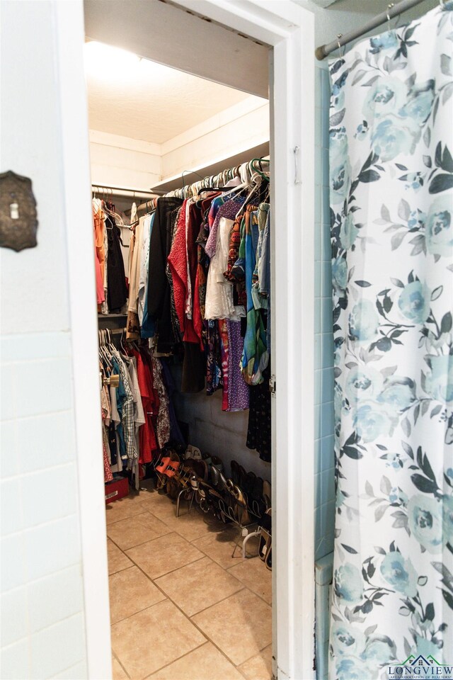 920 Deer Cove Rd, Avinger, TX 75630 - spacious closet with light tile patterned floors