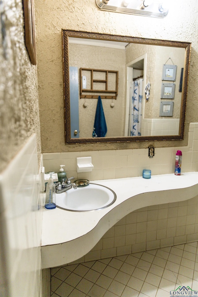 bathroom with tile patterned floors and sink