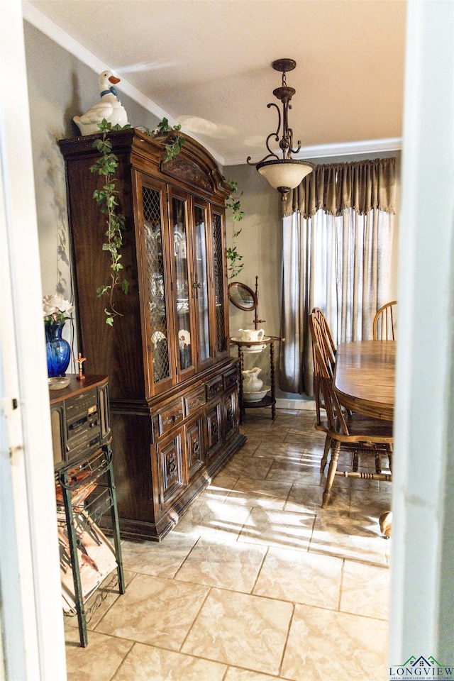 dining area featuring ornamental molding