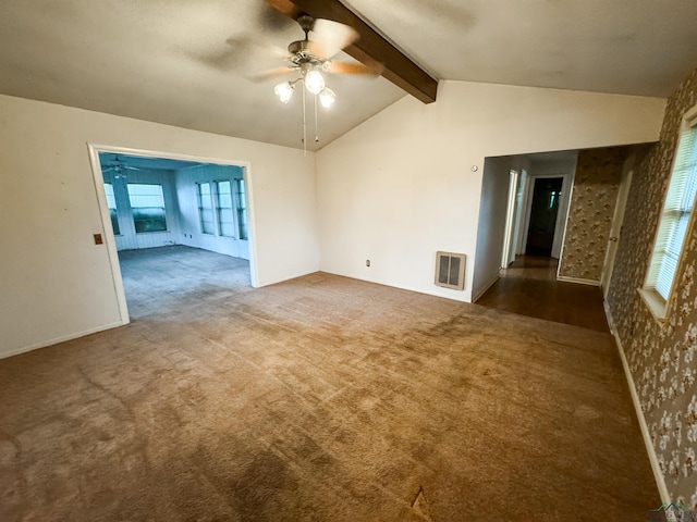 carpeted empty room with vaulted ceiling with beams and ceiling fan