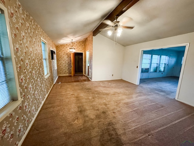 unfurnished living room featuring carpet, vaulted ceiling with beams, and ceiling fan