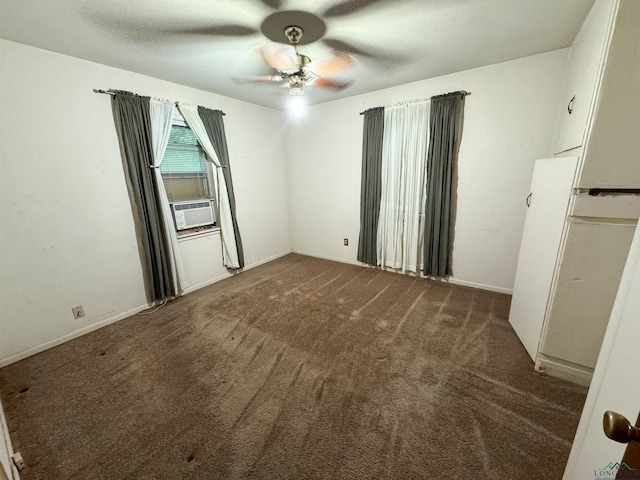 spare room with ceiling fan, cooling unit, and dark carpet