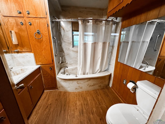 full bathroom with vanity, shower / bath combo with shower curtain, hardwood / wood-style flooring, toilet, and wood walls