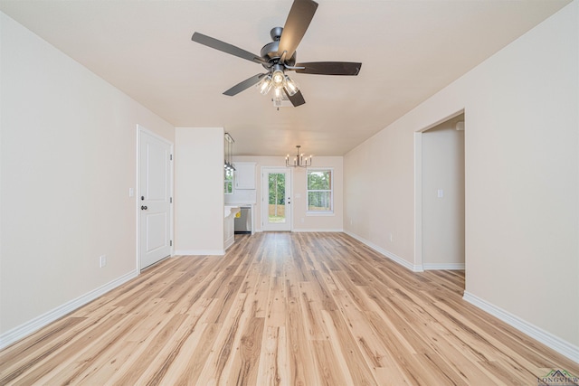 3603 Stracener Rd, Longview, TX 75605 - unfurnished living room featuring a chandelier, light wood finished floors, baseboards, and a ceiling fan