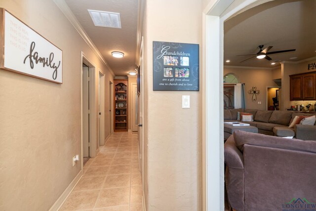 111 Winifreds Way, Hallsville, TX 75650 - corridor featuring ornamental molding, light tile patterned flooring, and visible vents
