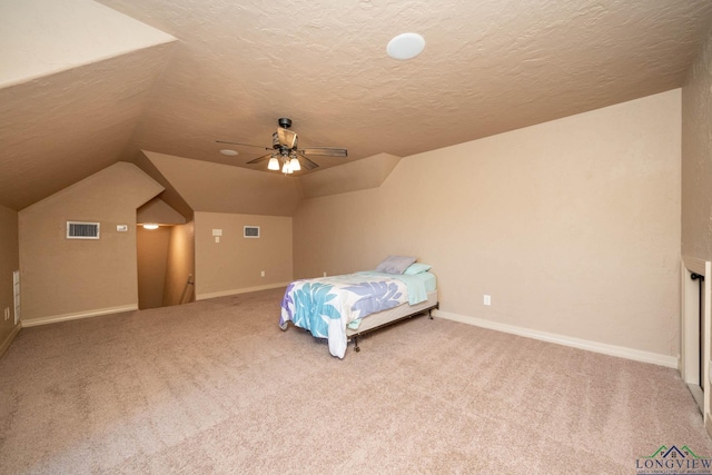 111 Winifreds Way, Hallsville, TX 75650 - bedroom with vaulted ceiling, carpet flooring, a textured ceiling, and visible vents