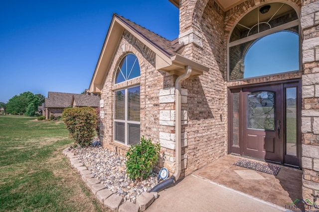 111 Winifreds Way, Hallsville, TX 75650 - entrance to property with brick siding and a lawn
