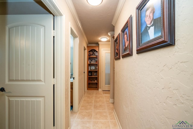 111 Winifreds Way, Hallsville, TX 75650 - hallway featuring light tile patterned flooring, a textured ceiling, crown molding, and baseboards
