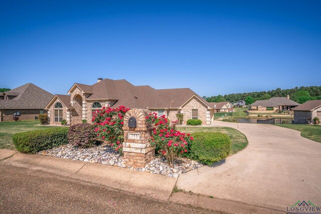 111 Winifreds Way, Hallsville, TX 75650 - view of front of house featuring brick siding and a residential view