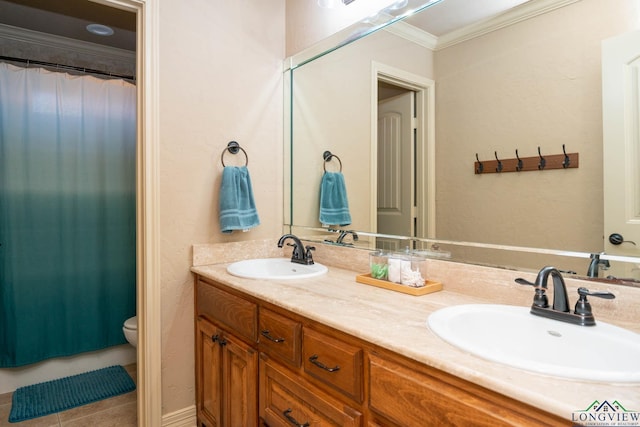 111 Winifreds Way, Hallsville, TX 75650 - bathroom featuring double vanity, crown molding, toilet, and a sink