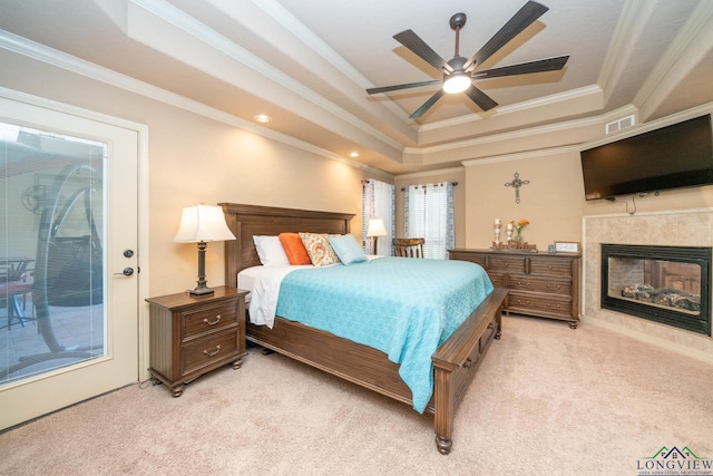 111 Winifreds Way, Hallsville, TX 75650 - bedroom with a tray ceiling, visible vents, ornamental molding, light carpet, and a fireplace