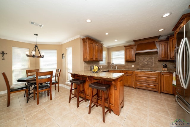 111 Winifreds Way, Hallsville, TX 75650 - kitchen featuring premium range hood, decorative backsplash, a peninsula, and visible vents