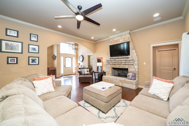 111 Winifreds Way, Hallsville, TX 75650 - living room with ceiling fan, arched walkways, ornamental molding, and dark wood-style flooring
